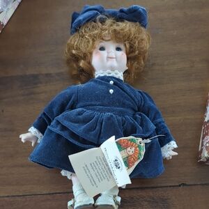 Vintage Style Porcelain Doll with Blue Dress
